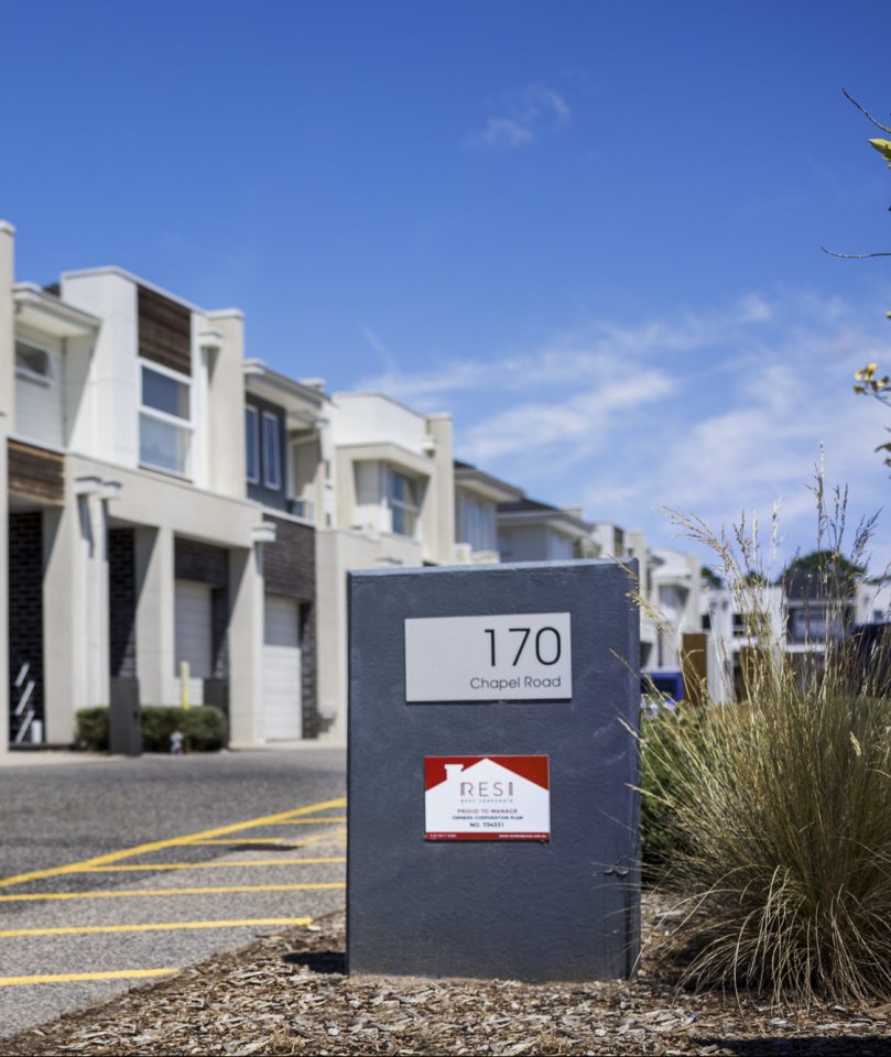 Townhouse body corporate with common driveway and gardens