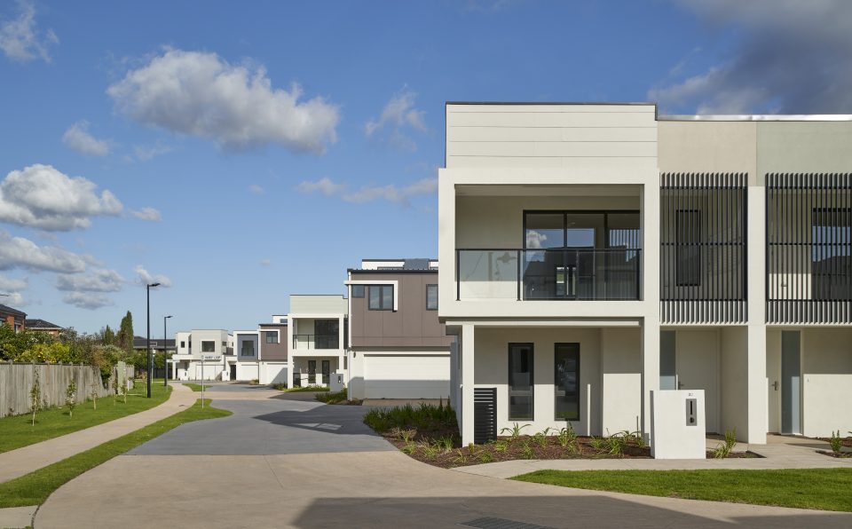 Townhouse estate showing driveway and common garden areas in body corporate Townhouse estate showing driveway and common garden areas in body corporate
