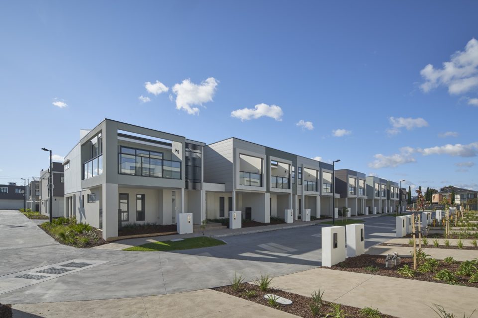 Townhouse body corporate with common driveway and gardens