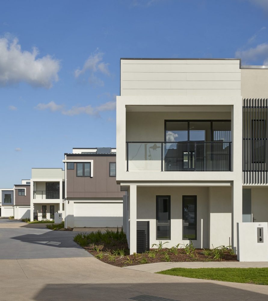 Body corporate townhouse estate with common gardens and driveway