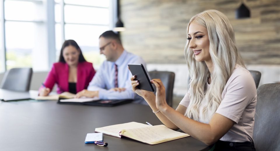 Strata manager reviewing documents in boardroom Strata manager reviewing documents in boardroom