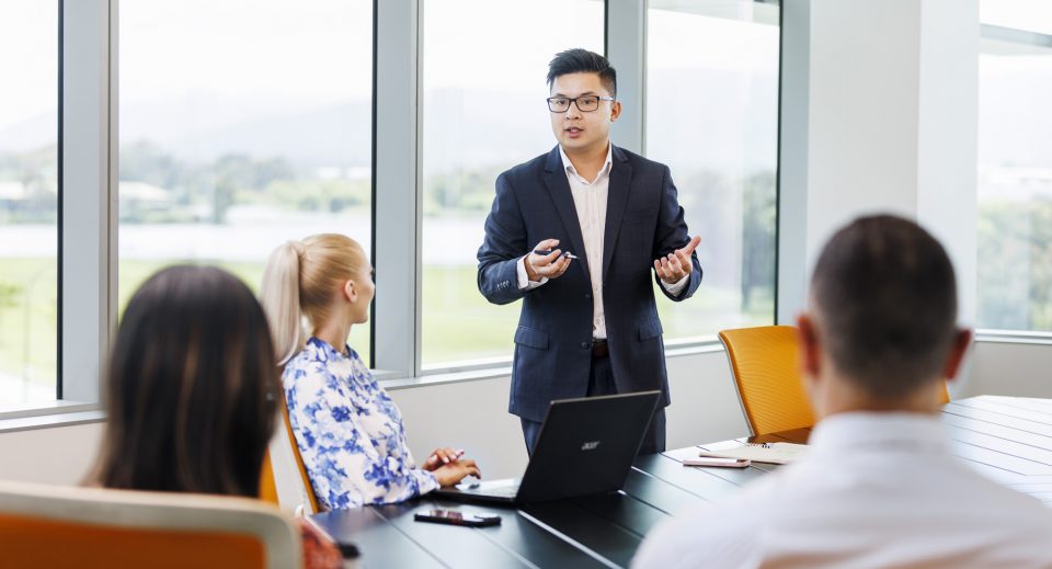 body corporate manager running an annual general meeting in a boardroom body corporate manager running an annual general meeting in a boardroom