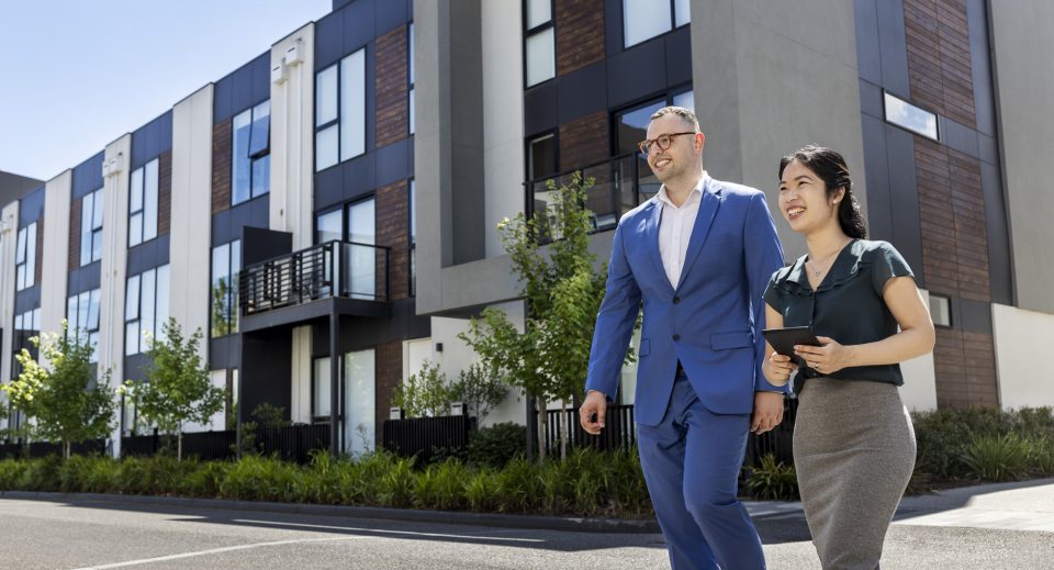Owners corporation managers conducting a site inspection of a townhouse estate Owners corporation managers conducting a site inspection of a townhouse estate
