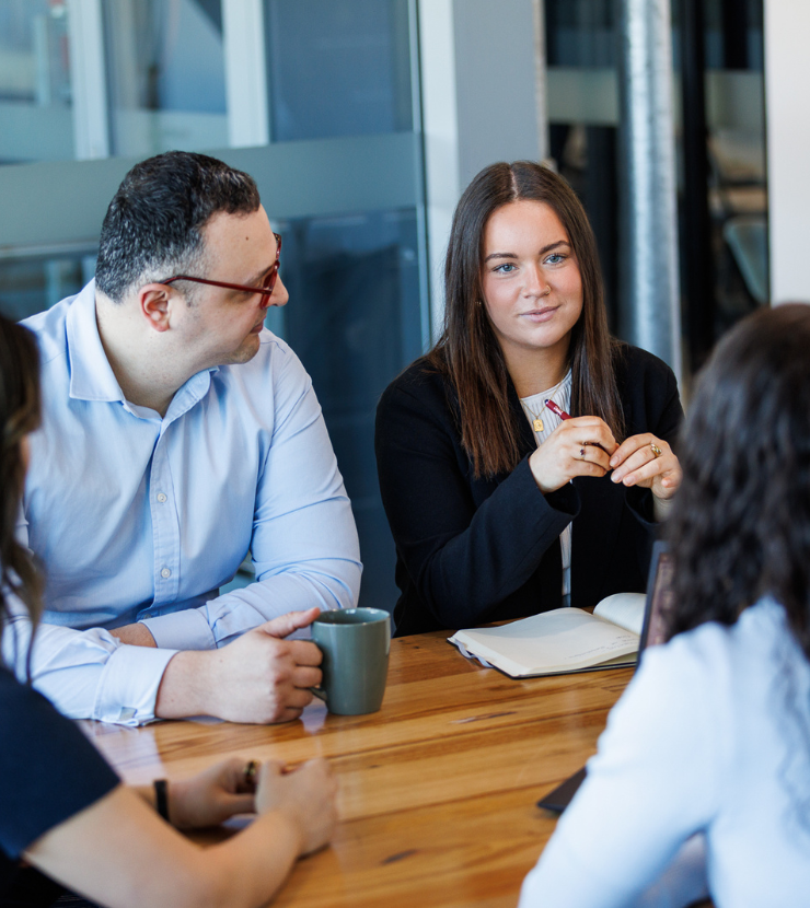 Strata managers having a casual meeting in the office